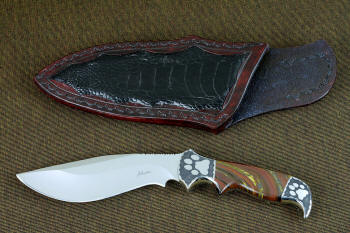 "Hooded Warrior" obverse side view in ATS-34 high molybdenum stainless steel blade, hand-engraved 304 stainless steel bolsters, Australian Tiger Iron gemstone handle, locking kydex, aluminum, stainless steel sheath