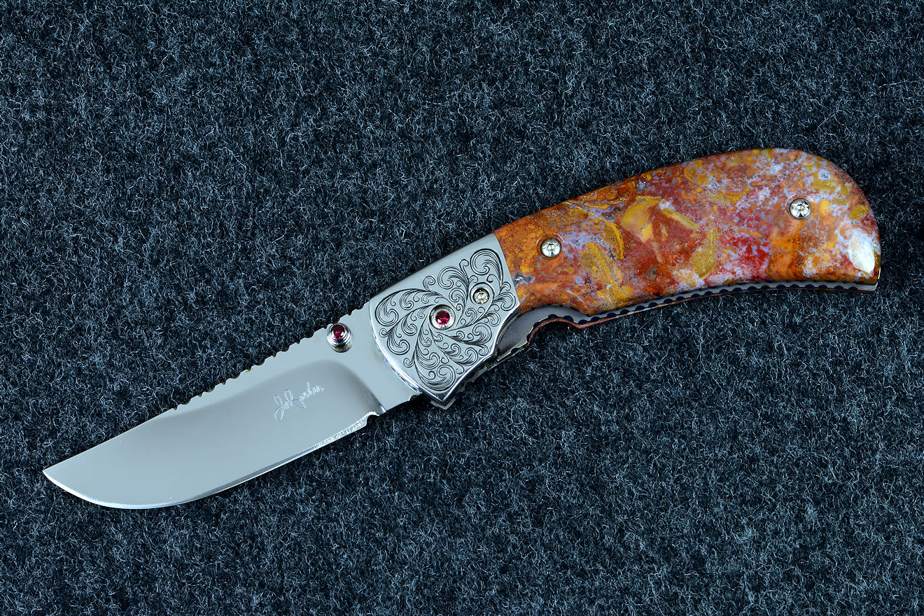 "Bellatrix" custom folding knife in T3 deep cryogenically treated ATS-34 high molybdenum martensitic stainless steel blade, hand-engraved 304 stainless steel bolsters, differerentially anodized 6AL4V titanium liners, Roostertail Agate gemstone handle, 304 stainless steel fasteners with garnet faceted gemstones