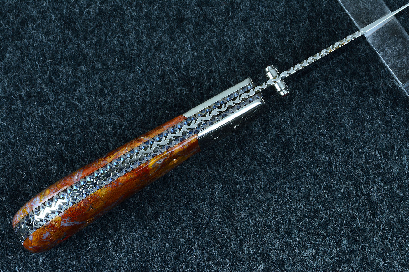 "Bellatrix" custom folding knife, spine view, note the differentially anodized titanium liners in gray and blue 