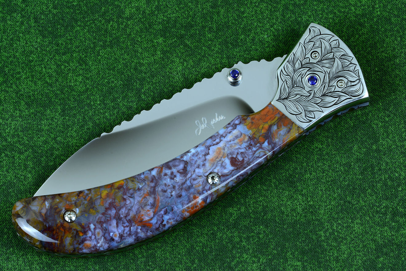 "Starling" fine handmade custom folding knife in T3 deep cryogenically treated ATS-34 high molybdenum martensitic stainless steel blade, hand-engraved 304 stainless steel bolsters, differentially anodized 6AL4V titanium liners, Rio Grande Agate gemstone handle, blue amethyst faceted gemstones set in 304 stainless steel fasteners and fittings "Starling" fine handmade custom folding knife in T3 deep cryogenically treated ATS-34 high molybdenum martensitic stainless steel blade, hand-engraved 304 stainless steel bolsters, differentially anodized 6AL4V titanium liners, Rio Grande Agate gemstone handle, blue amethyst faceted gemstones set in 304 stainless steel fasteners and fittings