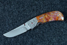 "Bellatrix" custom folding knife, obverse side view in T3 deep cryogenically treated ATS-34 high molybdenum martensitic stainless steel blade, hand-engraved 304 stainless steel bolsters, differerentially anodized 6AL4V titanium liners, Roostertail Agate gemstone handle, 304 stainless steel fasteners with garnet faceted gemstones