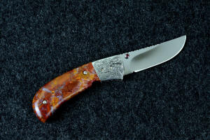 "Bellatrix" custom folding knife, reverse side view in T3 deep cryogenically treated ATS-34 high molybdenum martensitic stainless steel blade, hand-engraved 304 stainless steel bolsters, differerentially anodized 6AL4V titanium liners, Roostertail Agate gemstone handle, 304 stainless steel fasteners with garnet faceted gemstones