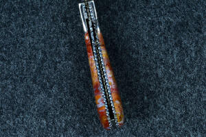 "Bellatrix" custom folding knife, inside spine detail; note the internal filework