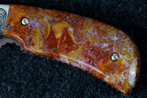 "Bellatrix" custom folding knife 6 power enlargement of obverse side handle scales, note the agate areas and depth of this fine, hard chalcedony gemstone