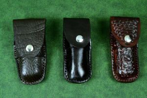 "Starling" fine handmade custom folding knife sheaths in American Bison (Buffalo) skin, black patent leather, and brown camouflage leather and stainless steel