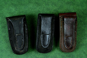 "Starling" fine handmade custom folding knife sheaths in American Bison (Buffalo) skin, black patent leather, and brown camouflage leather and stainless steel