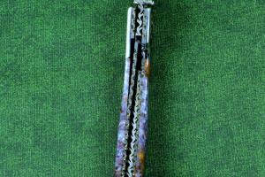 "Starling" fine handmade custom folding knife, inside spine filework view, liner and blade filework detail. Note differentially anodized blue and gold titanium liners and full fine filework throughout