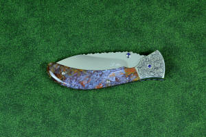"Starling" fine handmade custom folding knife, obverse side view in high molybdenum stainless steel blade, engraved stainless bolsters, faceted amethyst gemstone accents and Rio Grande Agate handle