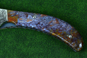 "Starling" obverse side gemstone handle detail in Rio Grande Agate with hand-engraved fasteners