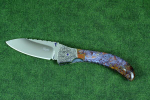 "Starling" fine handmade custom folding knife, obverse side view in high molybdenum stainless steel blade, engraved stainless bolsters, faceted amethyst gemstone accents and Rio Grande Agate handle