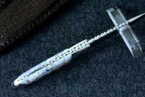 "Temno" fine handmade knife, spine detail view showing full filework, tapered tang and dovetailed gemstone and bolster fittings