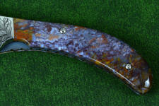Rio Grande Agate is hard and tough enough to support machine screws on a folding knife