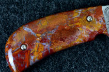 Roostertail agate is durable enough to support machine screws for a folding knife handle