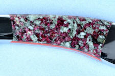 Eudialite has violet-red crystals throughout